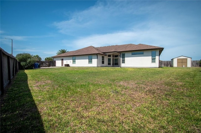 8054 Calgary Dr, Corpus Christi, TX 78414 - rear view of house featuring a storage shed, an outbuilding, and stucco siding