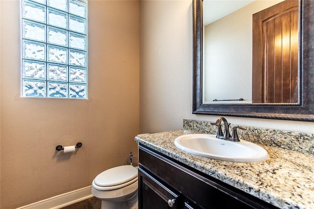 8054 Calgary Dr, Corpus Christi, TX 78414 - bathroom featuring toilet, vanity, and baseboards