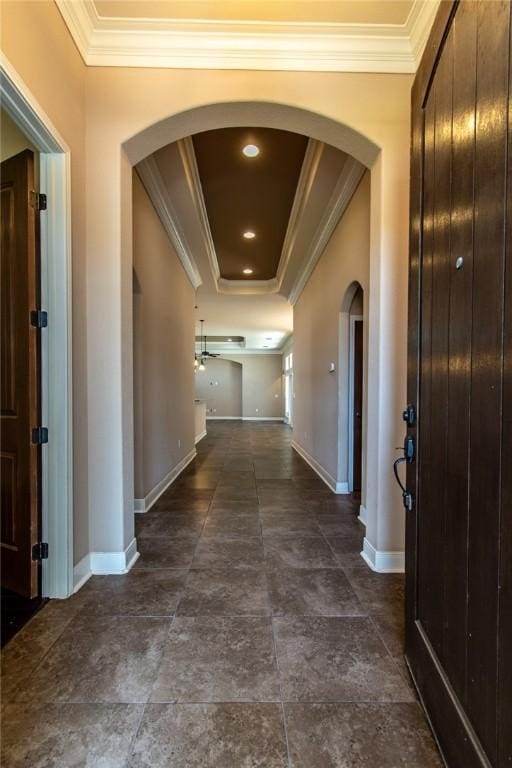 8054 Calgary Dr, Corpus Christi, TX 78414 - hall with arched walkways, crown molding, baseboards, and a raised ceiling