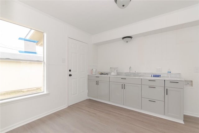 interior space with sink and light wood-type flooring