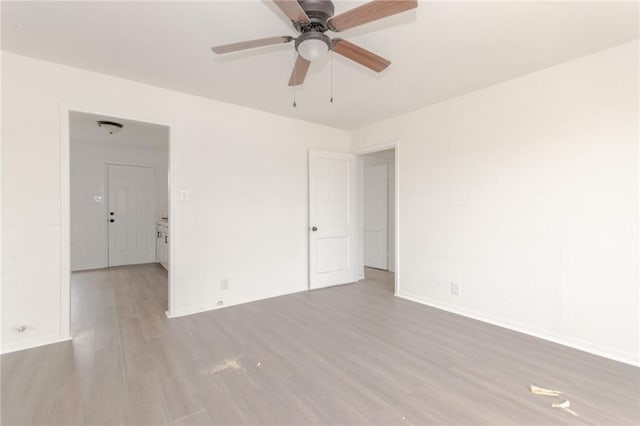 unfurnished room with light hardwood / wood-style floors and ceiling fan