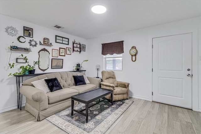 living room with light hardwood / wood-style flooring