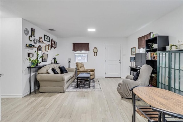 living room with light hardwood / wood-style floors