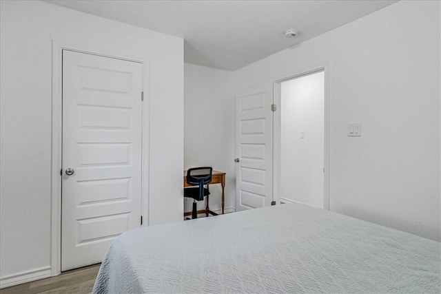 bedroom featuring hardwood / wood-style floors