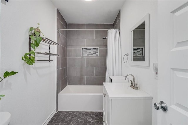 full bathroom featuring toilet, shower / bath combo, vanity, and tile patterned floors