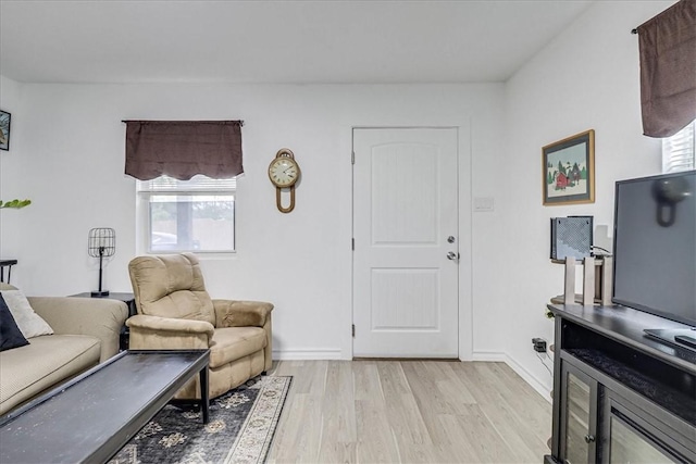 living room with light hardwood / wood-style floors