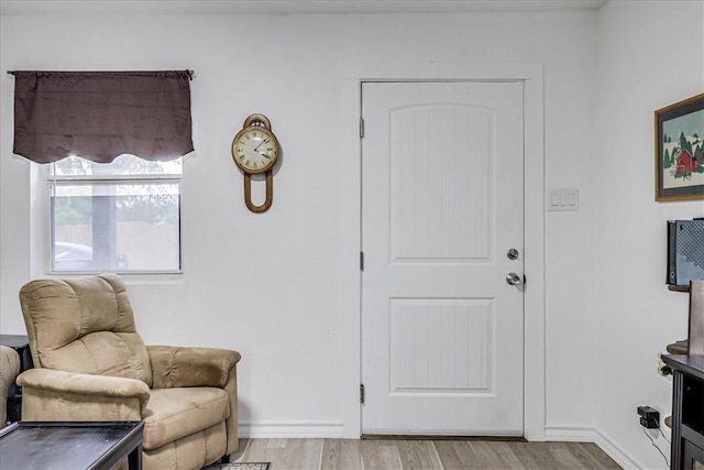 entryway with light hardwood / wood-style floors