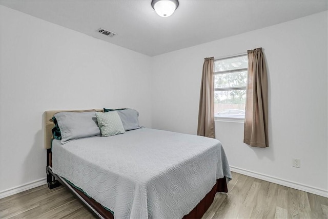 bedroom with light hardwood / wood-style flooring