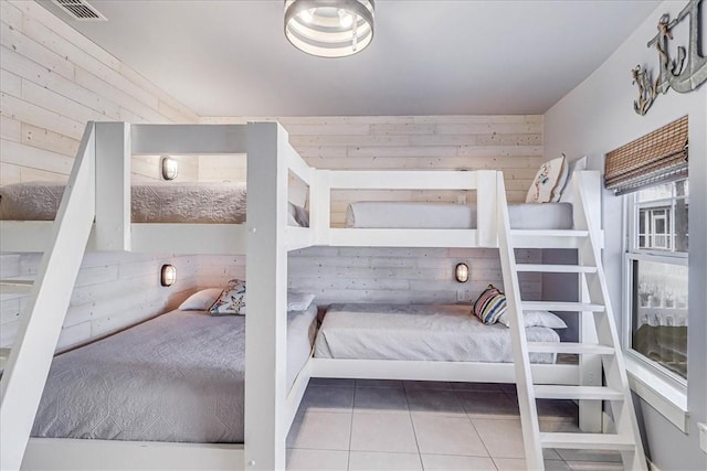 tiled bedroom with wood walls