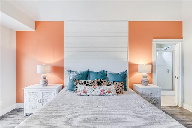 bedroom with wood-type flooring