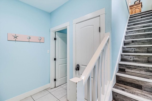 stairs with tile patterned flooring