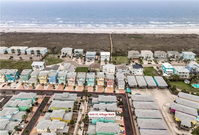 drone / aerial view with a water view and a view of the beach