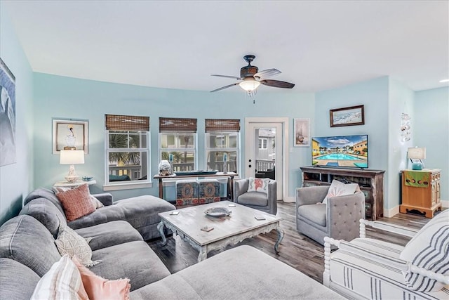 living room featuring ceiling fan and wood-type flooring