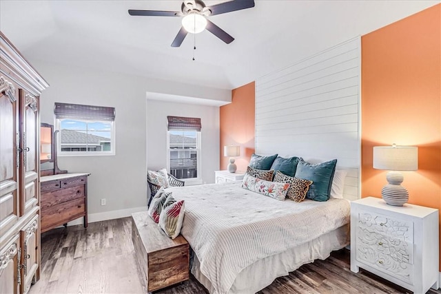 bedroom with dark wood-type flooring and ceiling fan