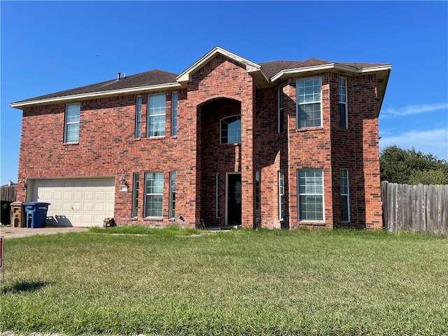 view of front of home featuring a front lawn and a garage