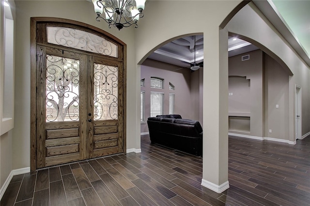 foyer featuring french doors, dark hardwood / wood-style flooring, and a healthy amount of sunlight