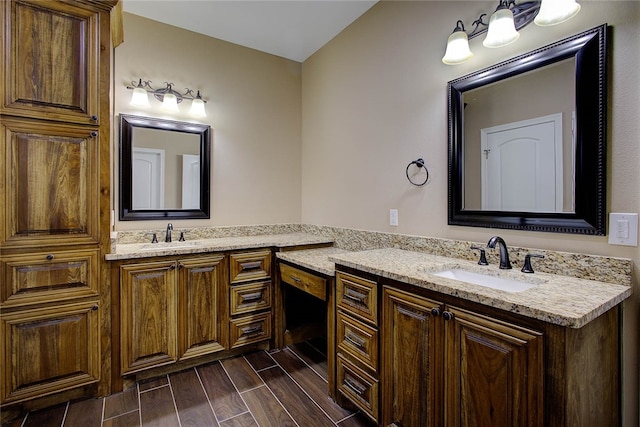 bathroom with hardwood / wood-style floors and vanity