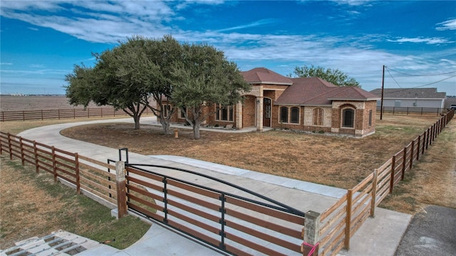 view of front facade featuring a rural view