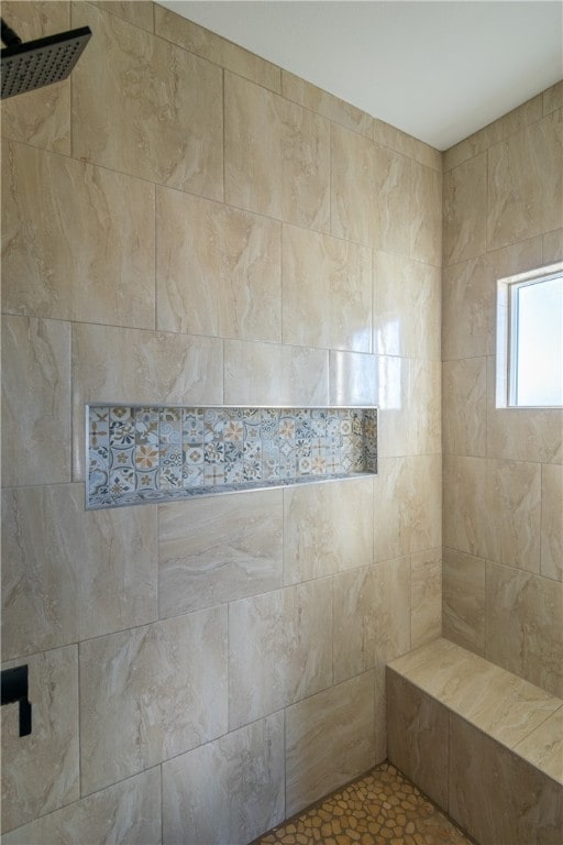 bathroom featuring tiled shower