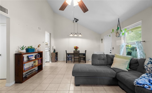 tiled living room featuring high vaulted ceiling and ceiling fan