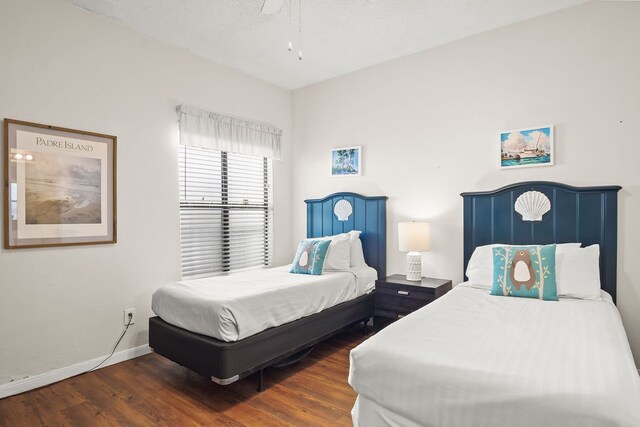 bedroom with ceiling fan and dark hardwood / wood-style floors