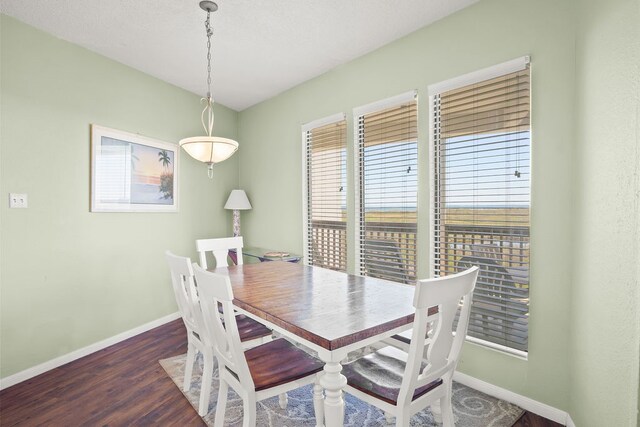 dining area featuring dark hardwood / wood-style floors