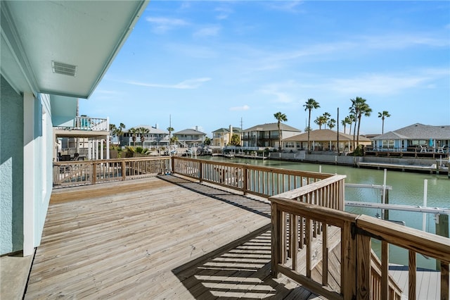 wooden deck with a water view