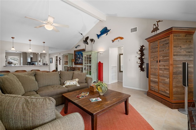 living room with vaulted ceiling with beams, ceiling fan, and light tile patterned floors