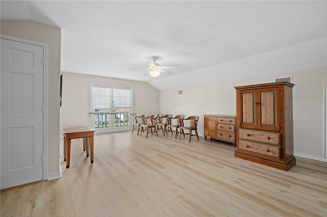 interior space with french doors, light hardwood / wood-style flooring, ceiling fan, and vaulted ceiling