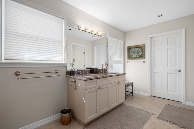 bathroom with vanity and tile patterned flooring