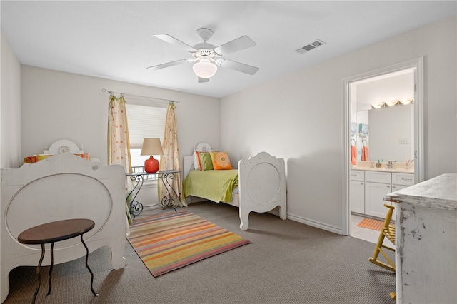 bedroom with ensuite bath, light carpet, ceiling fan, and sink