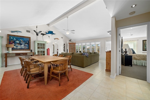 dining room featuring a wealth of natural light, vaulted ceiling with beams, ceiling fan, and light tile patterned flooring