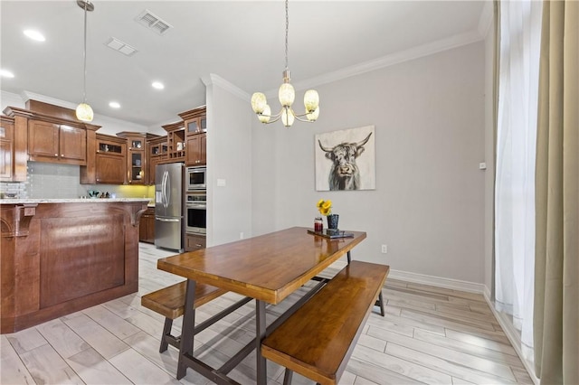dining area featuring crown molding, a chandelier, recessed lighting, light wood-type flooring, and baseboards