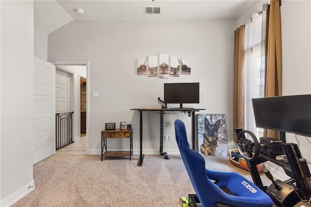carpeted home office with baseboards and lofted ceiling