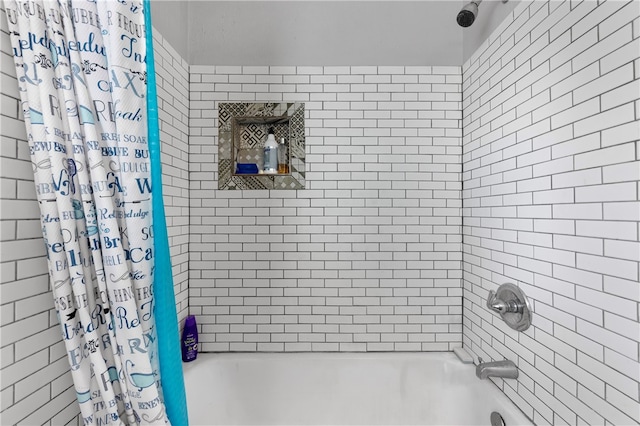 bathroom featuring shower / bathtub combination with curtain