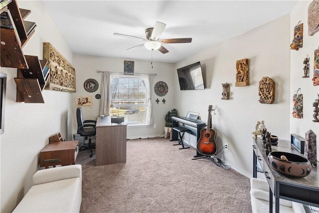 office area featuring baseboards, carpet floors, and ceiling fan