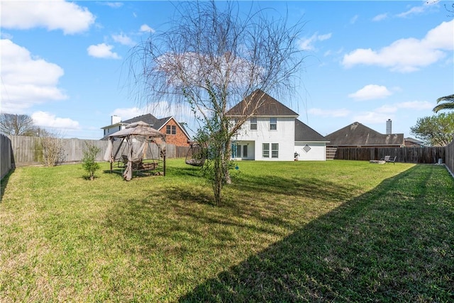 view of yard with a gazebo and a fenced backyard