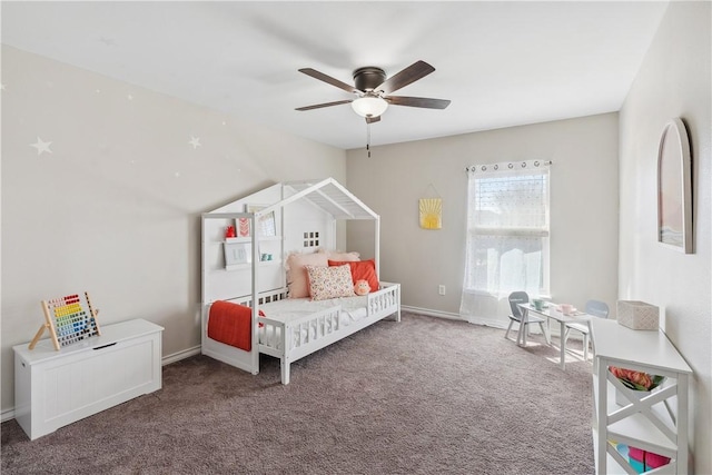 carpeted bedroom with baseboards and a ceiling fan