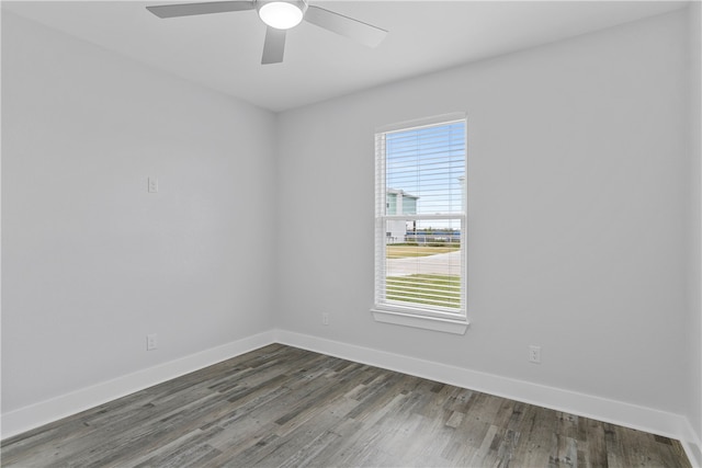 empty room featuring dark hardwood / wood-style floors and ceiling fan