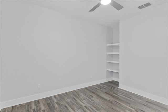 spare room featuring hardwood / wood-style floors and ceiling fan