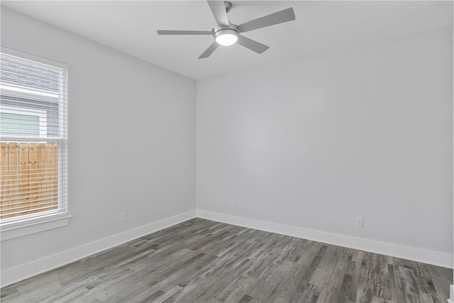 unfurnished room with hardwood / wood-style flooring, a wealth of natural light, and ceiling fan