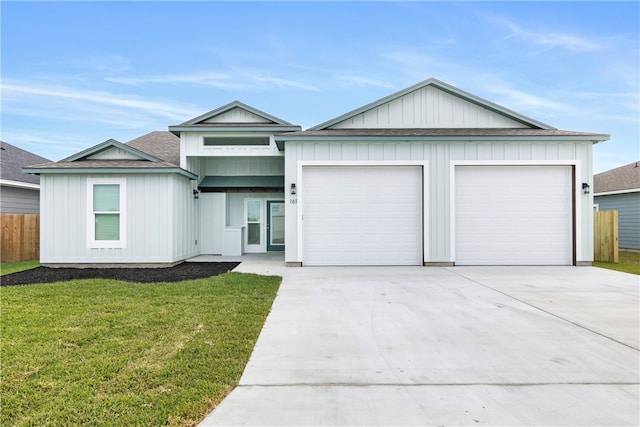 view of front facade featuring a garage and a front lawn