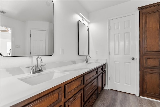 bathroom with vanity and hardwood / wood-style floors