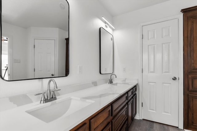 bathroom featuring vanity and hardwood / wood-style floors