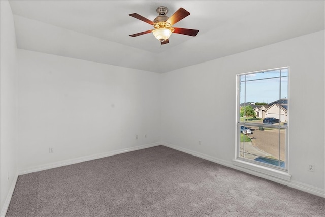 unfurnished room with carpet flooring and ceiling fan