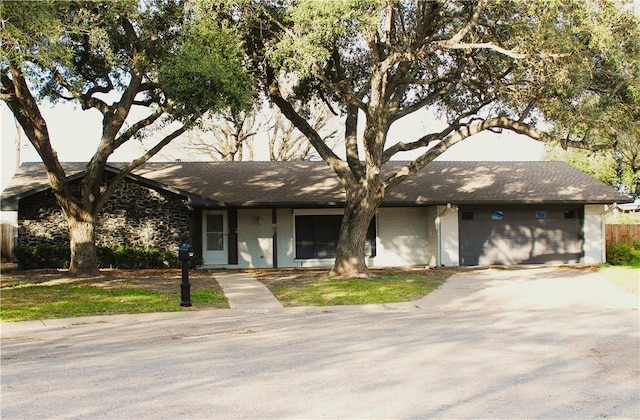 single story home with a garage