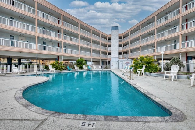 3938 Surfside Blvd Unit 2201, Corpus Christi, TX 78402 - community pool with a patio