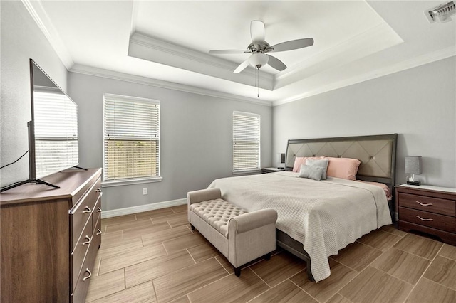 7209 Lake Tranquility Dr, Corpus Christi, TX 78414 - bedroom with a tray ceiling, crown molding, wood tiled floors, and a ceiling fan
