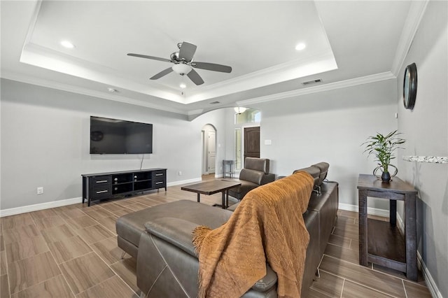 7209 Lake Tranquility Dr, Corpus Christi, TX 78414 - living area featuring a tray ceiling, arched walkways, ceiling fan, recessed lighting, and wood tiled floors