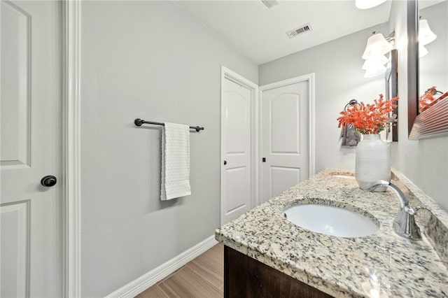 7209 Lake Tranquility Dr, Corpus Christi, TX 78414 - bathroom with wood finished floors and vanity